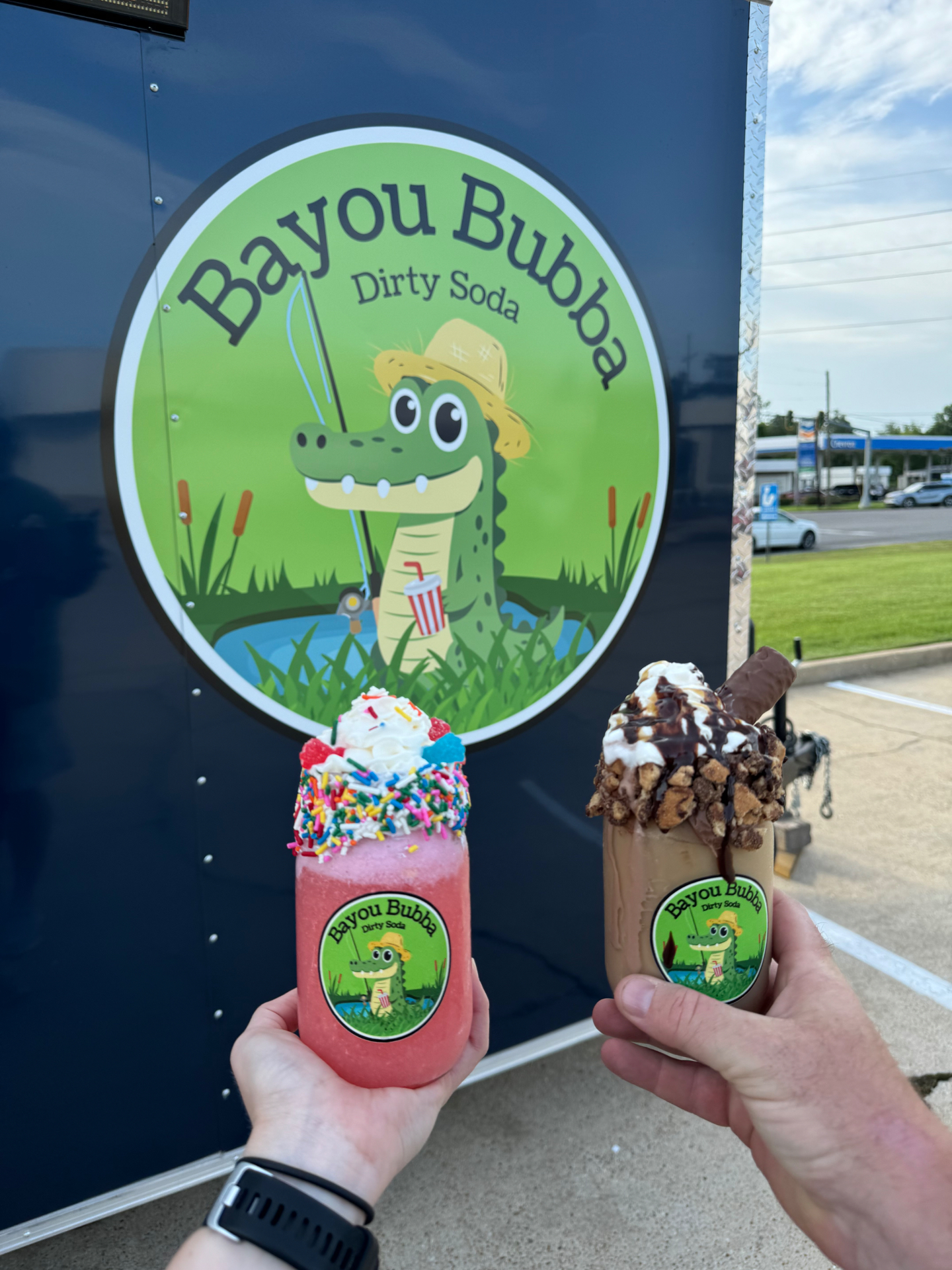 Two colorful loaded dirty sodas in front of the Bayou Bubba trailer